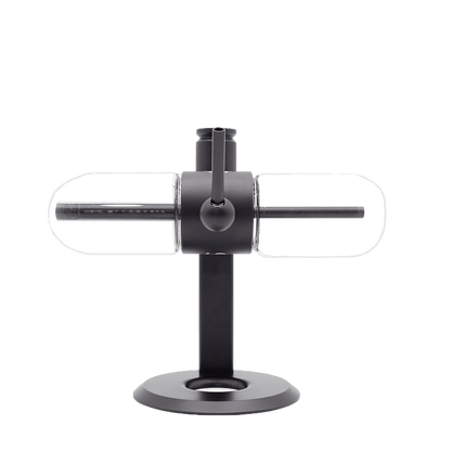 Stündenglass Gravity Infuser in motion mid-rotation with cascading water